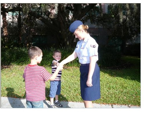 Deb Benson's young sons Brock and Max thank a young airman in 2007, the moment that started Grateful American Coin