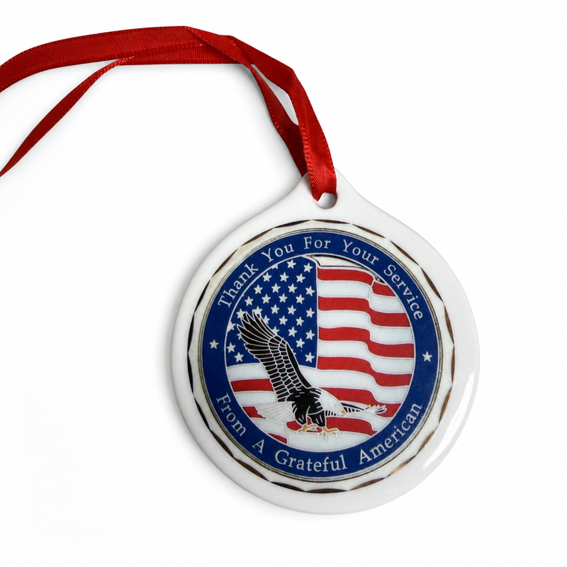 Ceramic ornament front with red ribbon, American flag and eagle